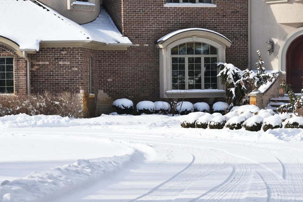 Light snowfall on a residential driveway in winter